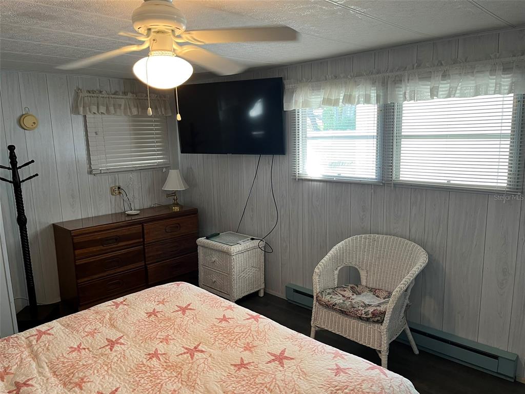 1040 Main Street, Unit 192 Dunedin, FL 34698 - Photo 10 of 15 a kitchen with a wooden floor and a view of living room