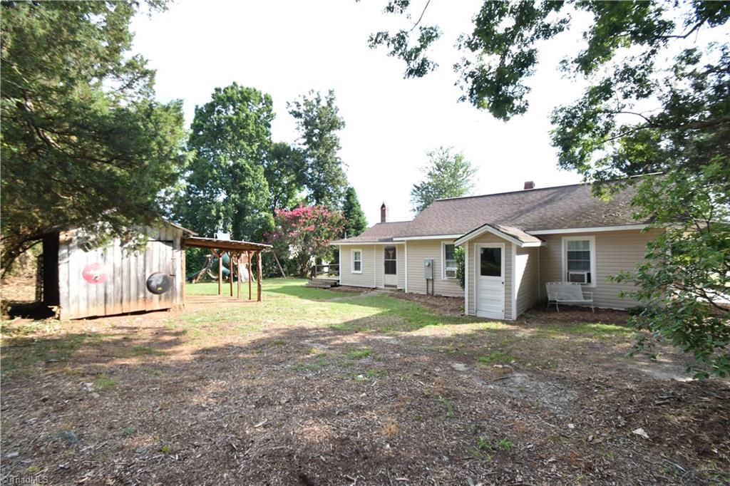 5204 Harvey Road Jamestown, NC 27282 - Photo 22 of 30 Side Yard with Storage Building.