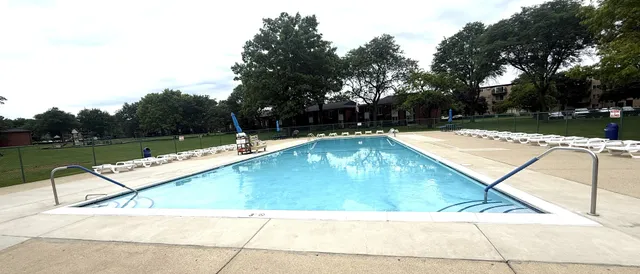 a view of swimming pool with lounge chair