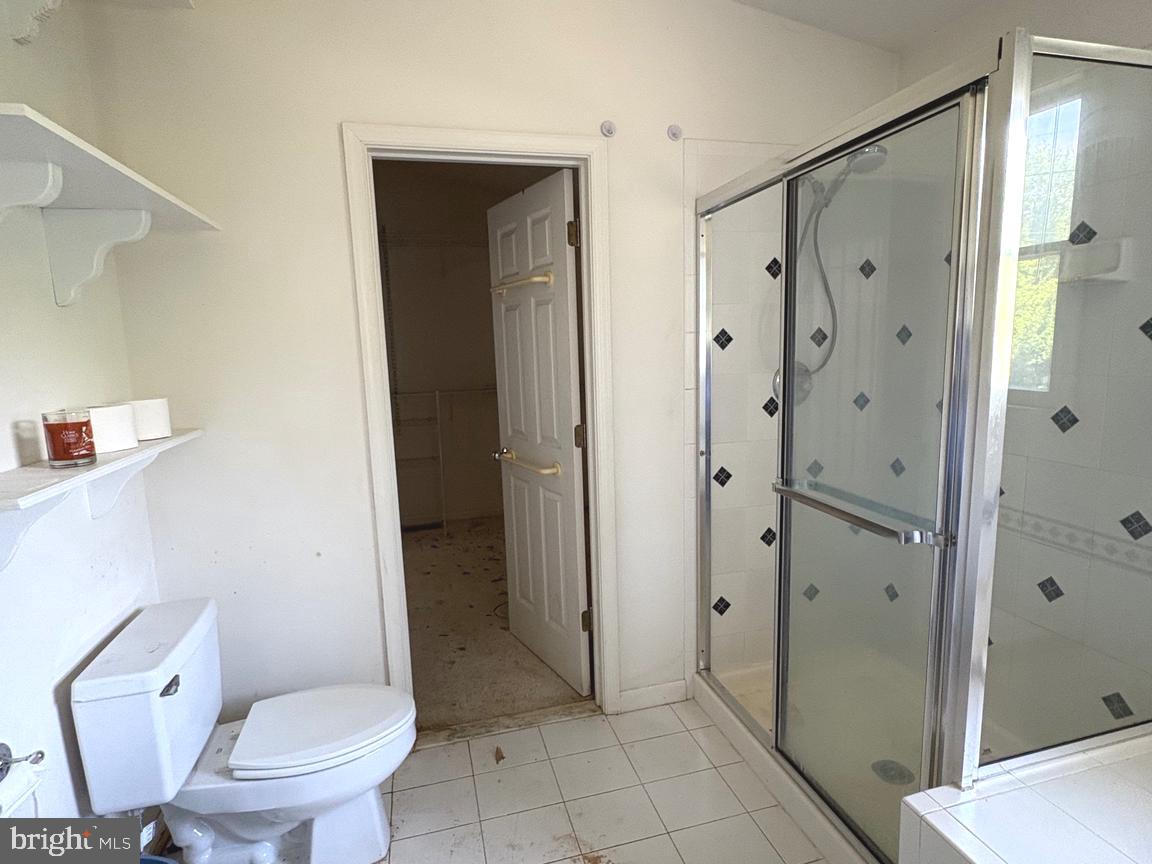 4215 Buffalo Road Mount Airy, MD 21771 - Photo 11 of 44 a bathroom with a shower and a toilet