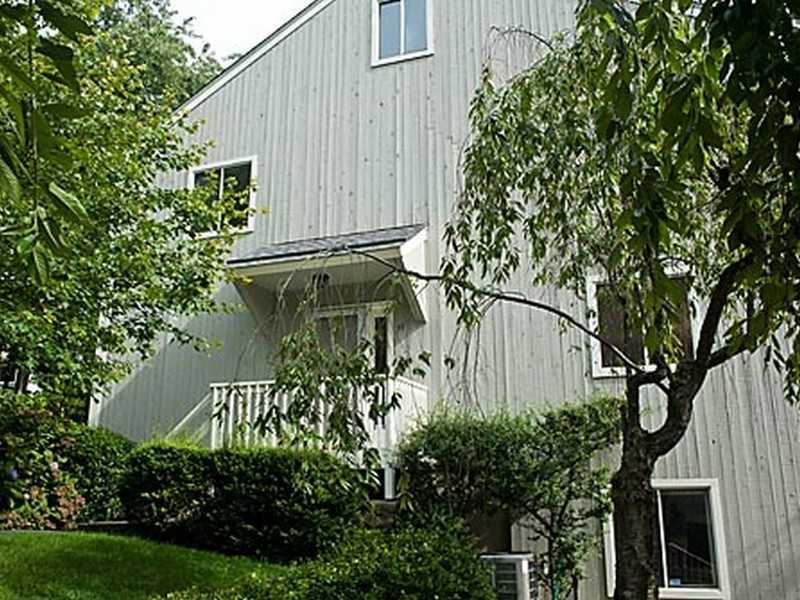 57 Stirrup Lane, Unit 57 Riverside, CT 06878 - Photo 1 of 17 a backyard of a house with lots of green space