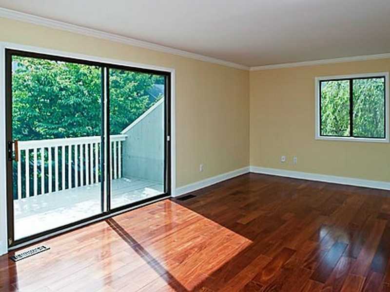 57 Stirrup Lane, Unit 57 Riverside, CT 06878 - Photo 5 of 17 a view of a room with wooden floor and balcony