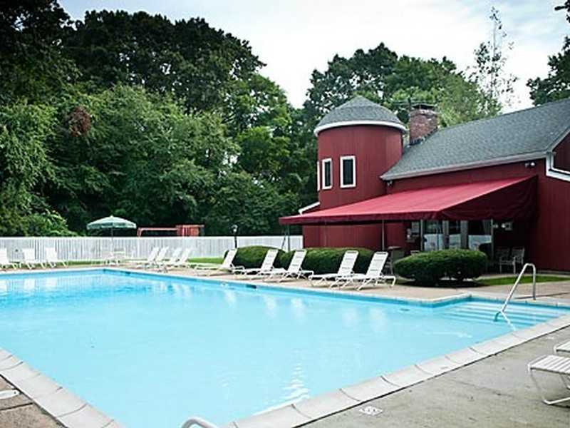 57 Stirrup Lane, Unit 57 Riverside, CT 06878 - Photo 9 of 17 a view of a house with pool and chairs