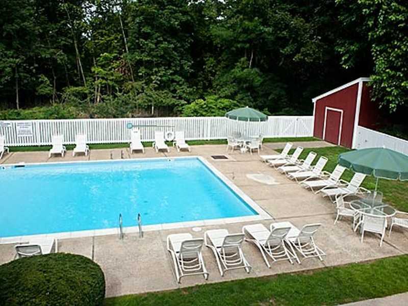 57 Stirrup Lane, Unit 57 Riverside, CT 06878 - Photo 10 of 17 a view of a swimming pool with a patio