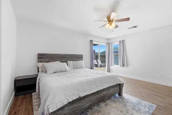 a bedroom with a bed and a table