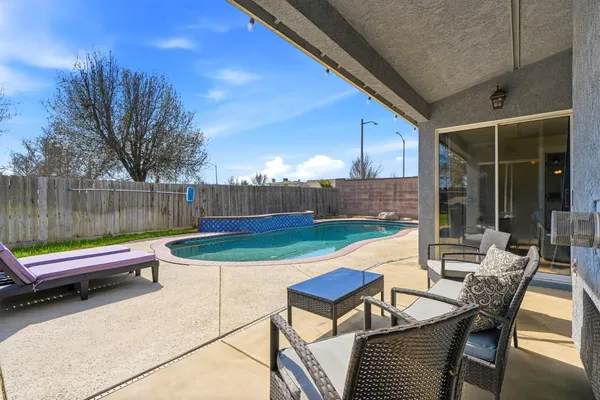 a view of a swimming pool with a lounge chair