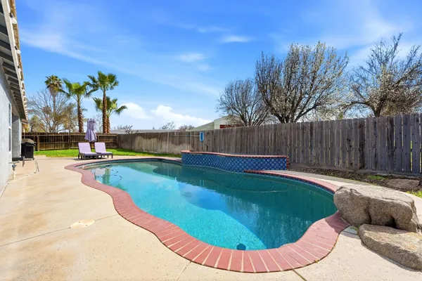 a view of a house with swimming pool
