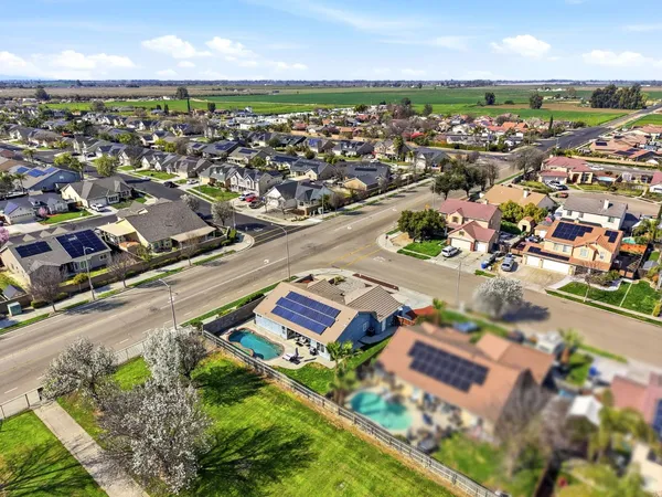 an aerial view of a house with swimming pool