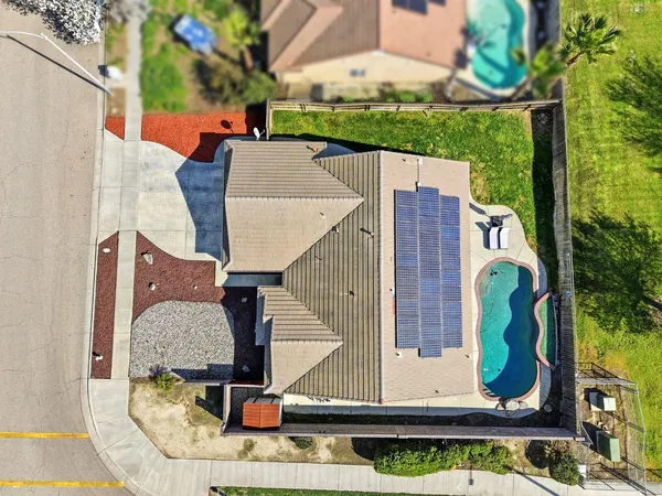 an aerial view of a house with outdoor space