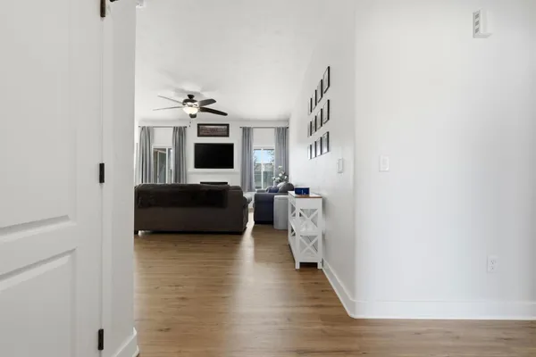 a living room with furniture fireplace and flat screen tv