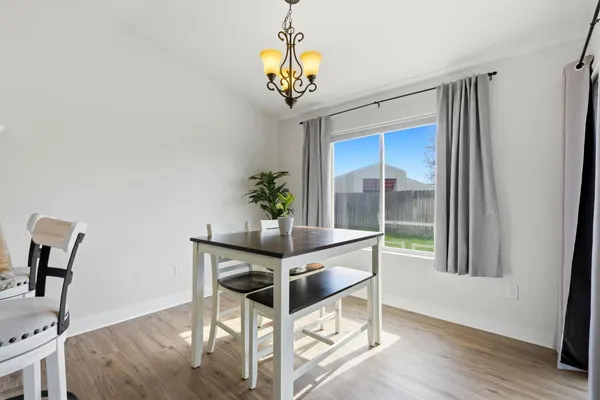 a kitchen with kitchen island a counter space a sink and a stove