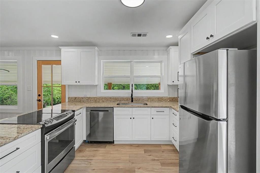 2115 King Road Dalton, GA 30720 - Photo 11 of 54 a kitchen with a sink stove and refrigerator