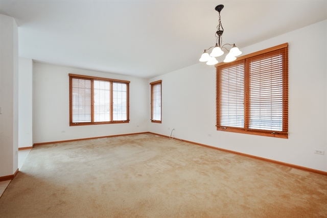 15652 Scotsglen Road Orland Park, IL 60462 - Photo 2 of 15 a view of an empty room with a window