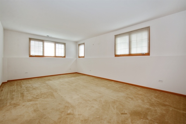 15652 Scotsglen Road Orland Park, IL 60462 - Photo 11 of 15 an empty room with a window