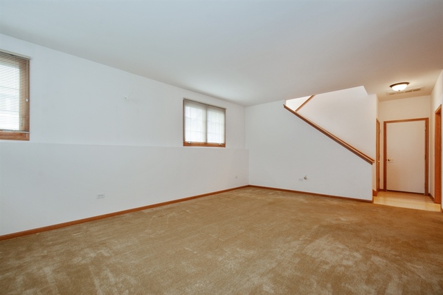 15652 Scotsglen Road Orland Park, IL 60462 - Photo 12 of 15 an empty room with windows