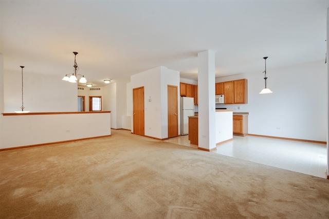 15652 Scotsglen Road Orland Park, IL 60462 - Photo 3 of 15 a view of a kitchen with a sink and a refrigerator