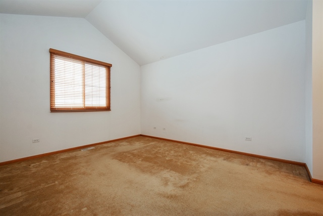 15652 Scotsglen Road Orland Park, IL 60462 - Photo 6 of 15 an empty room with a window