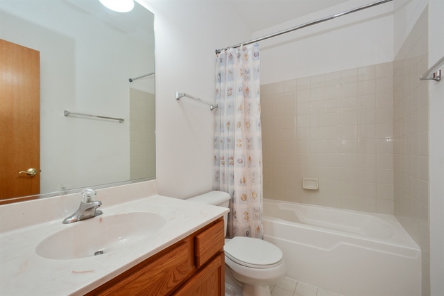 15652 Scotsglen Road Orland Park, IL 60462 - Photo 10 of 15 a bathroom with a sink toilet and shower
