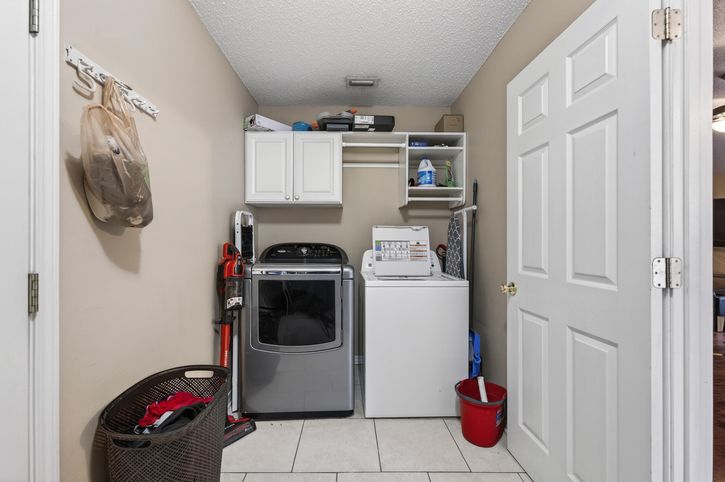 4717 Whitewater Lane Crestview, FL 32539 - Photo 20 of 55 a utility room with sink dryer and washer