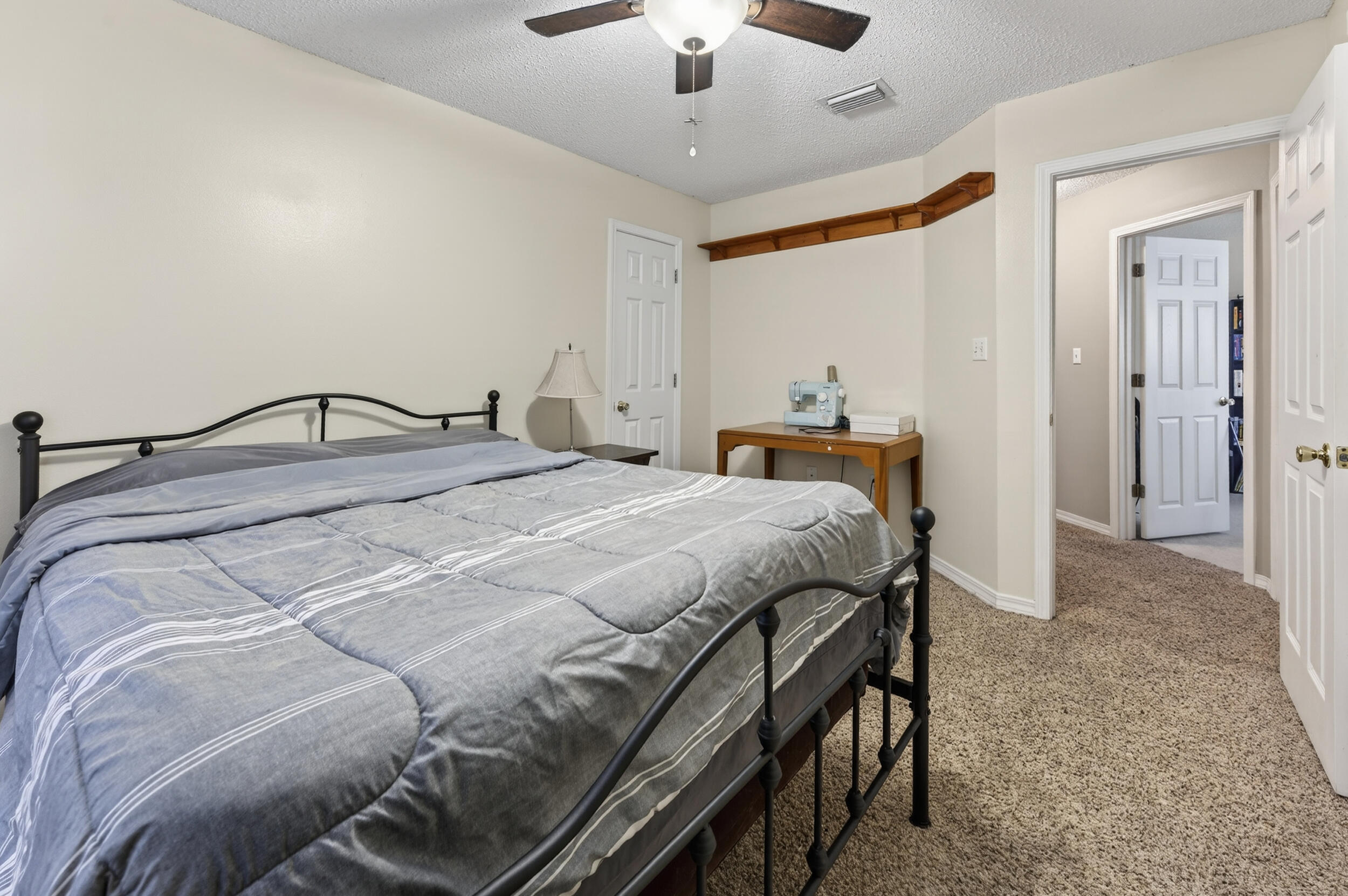 4717 Whitewater Lane Crestview, FL 32539 - Photo 25 of 55 a bedroom with a bed and a chandelier