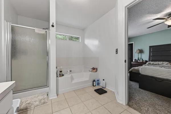 a view of a workspace with furniture and a bookshelf