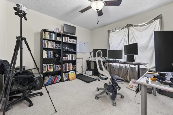 a bedroom with a bed and a table in it