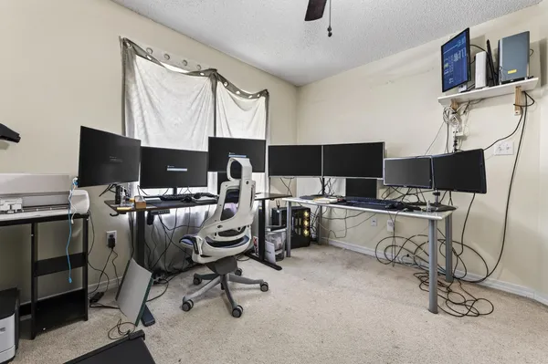 a bedroom with a bed and flat screen tv