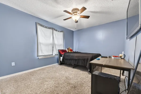 a view of a deck with furniture and trees