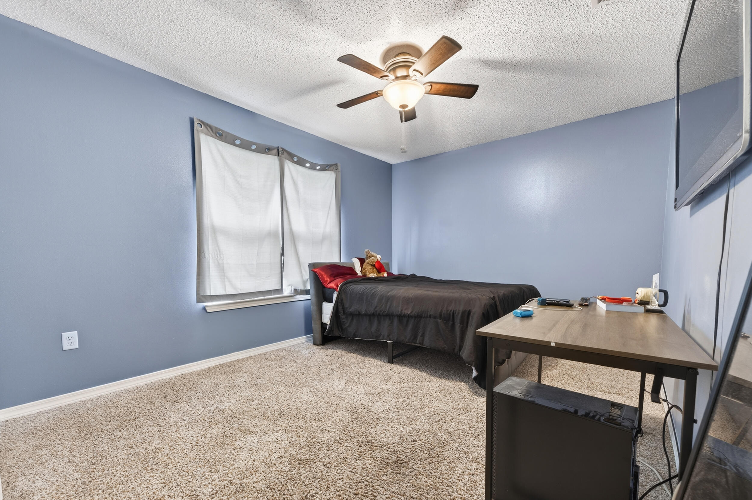4717 Whitewater Lane Crestview, FL 32539 - Photo 40 of 55 a bedroom with a bed and a table in it
