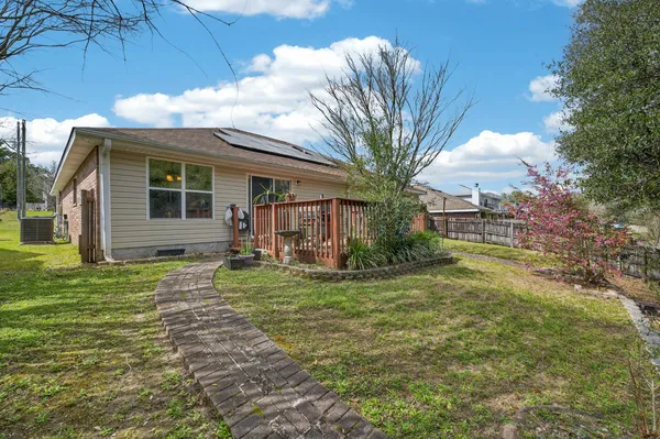 a view of a yard with a tree