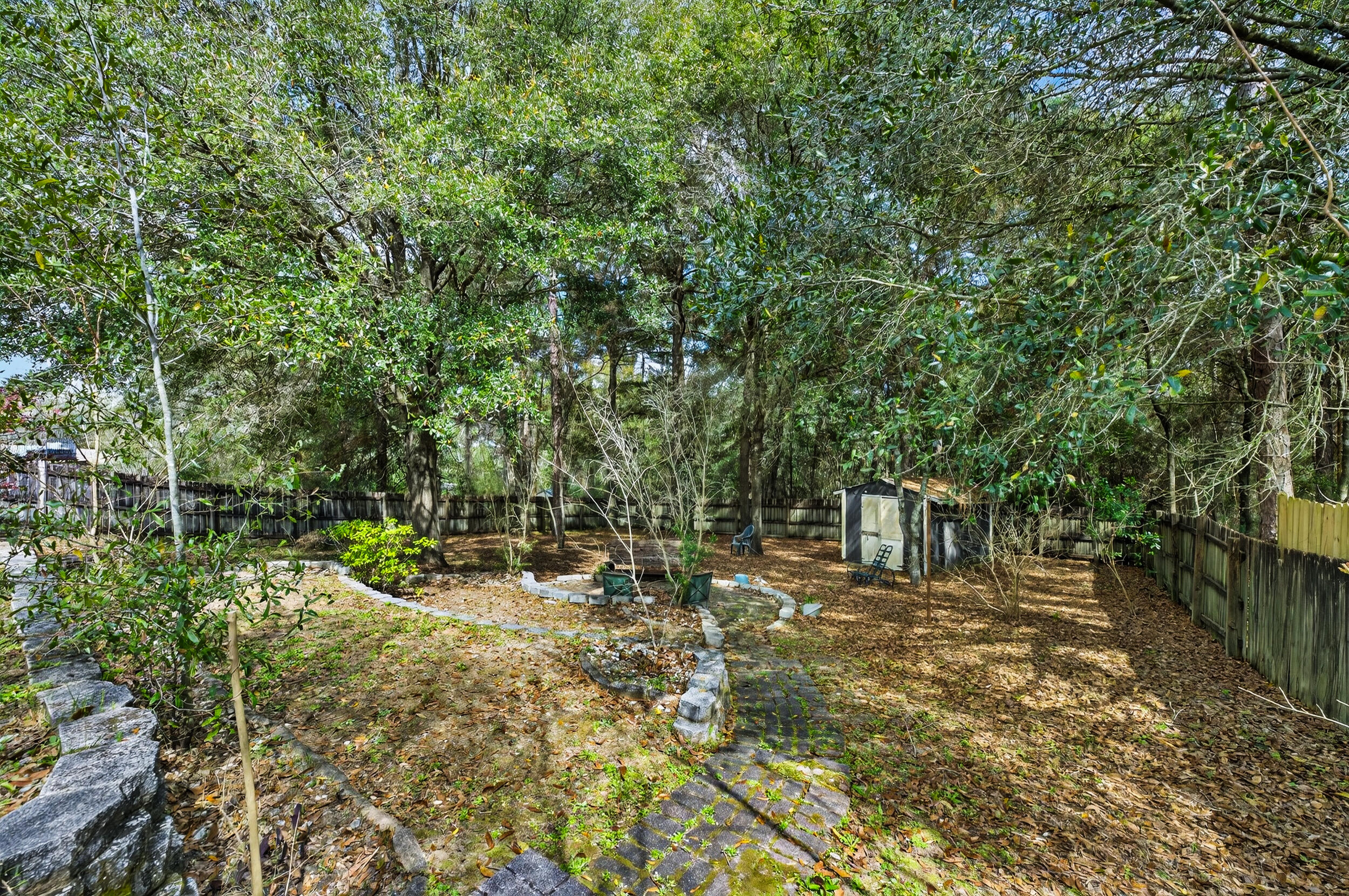 4717 Whitewater Lane Crestview, FL 32539 - Photo 47 of 55 a backyard of a house with lots of green space