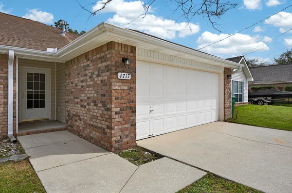 a front view of a house with a garage