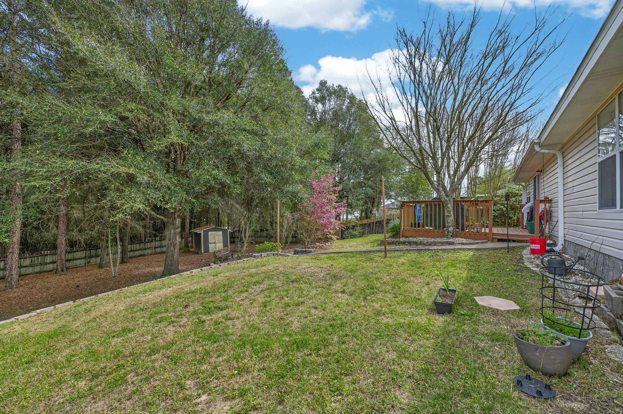 4717 Whitewater Lane Crestview, FL 32539 - Photo 54 of 55 a backyard of a house with lots of green space