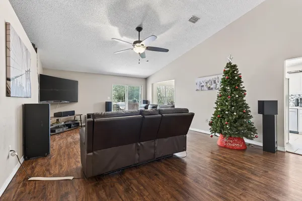 a living room with furniture and a flat screen tv