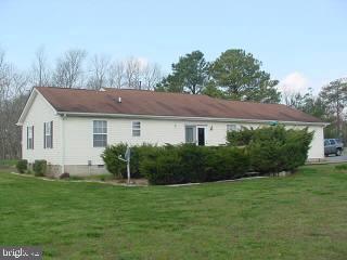 8747 New Hope Road Willards, MD 21874 - Photo 2 of 11 a house view with a garden space