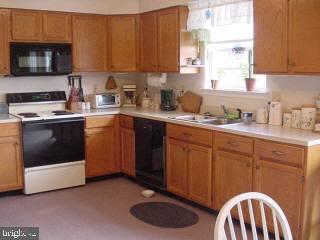 8747 New Hope Road Willards, MD 21874 - Photo 4 of 11 a kitchen with a sink cabinets and a window