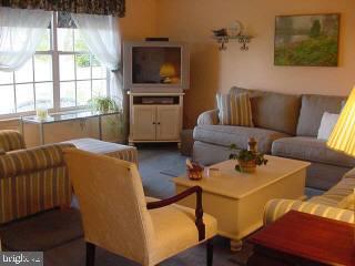 8747 New Hope Road Willards, MD 21874 - Photo 5 of 11 a living room with furniture and a flat screen tv