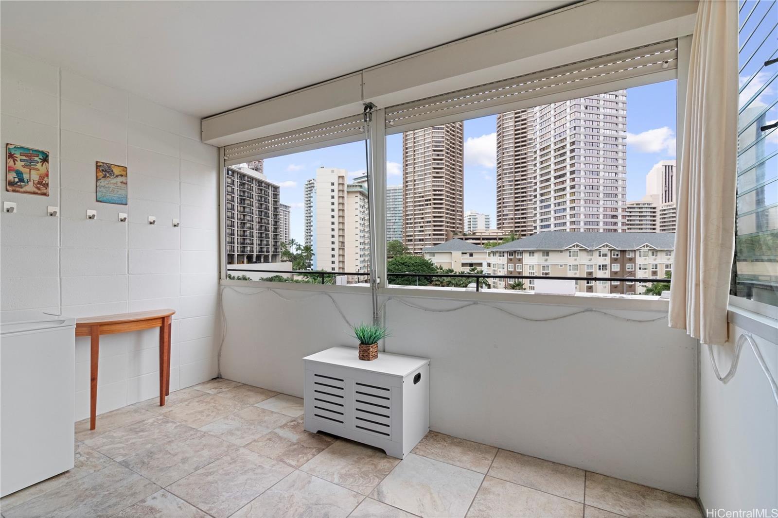 425 Ena Road, Unit B501 Honolulu, HI 96815 - Photo 8 of 16 a room with window and furniture