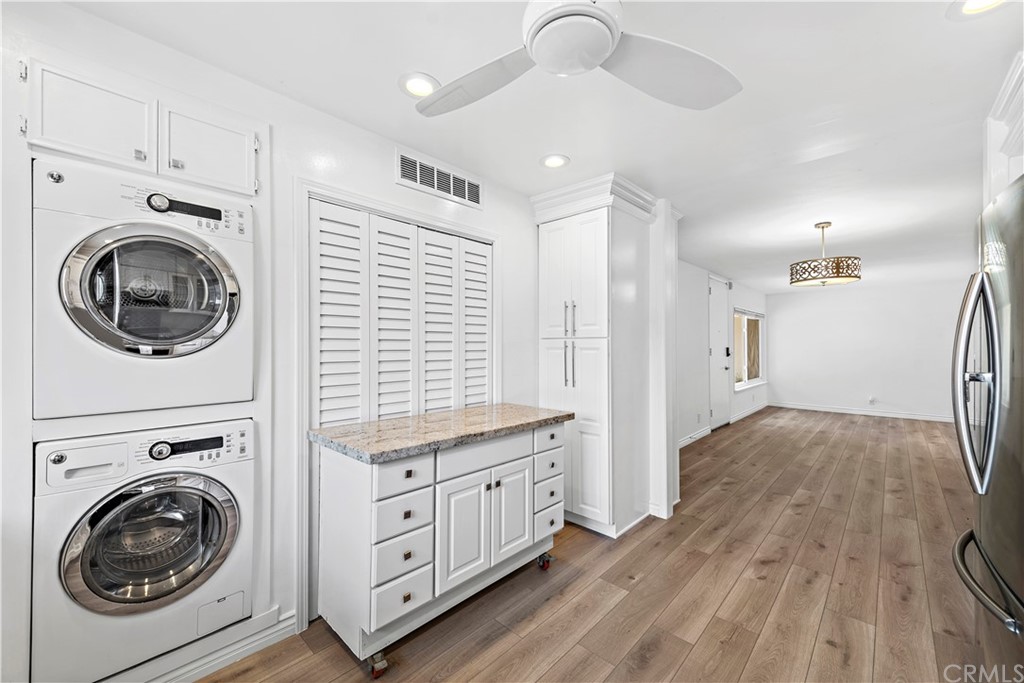 520 Cliff Drive, Unit 303 Laguna Beach, CA 92651 - Photo 14 of 46 a view of a kitchen with a sink dryer and washer