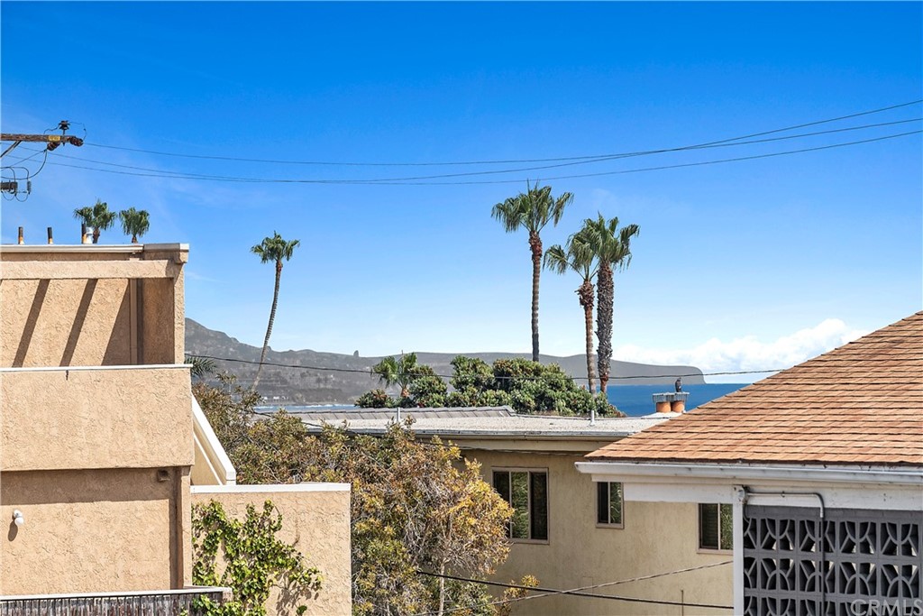 520 Cliff Drive, Unit 303 Laguna Beach, CA 92651 - Photo 25 of 46 a view of a house with a backyard