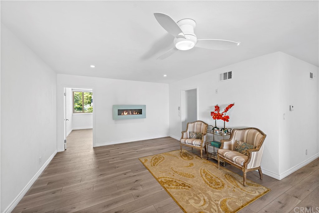 520 Cliff Drive, Unit 303 Laguna Beach, CA 92651 - Photo 27 of 46 a living room with furniture and a wooden floor