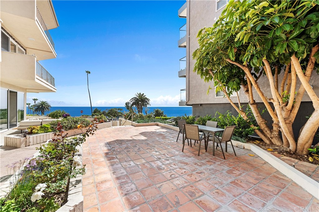 520 Cliff Drive, Unit 303 Laguna Beach, CA 92651 - Photo 28 of 46 a view of a backyard with sitting area