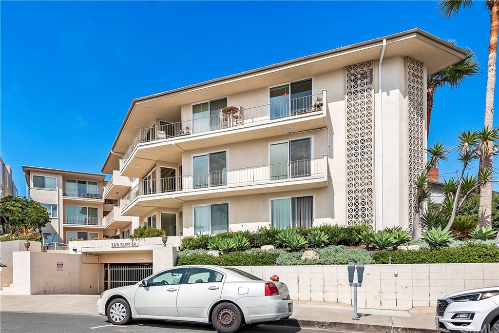 520 Cliff Drive, Unit 303 Laguna Beach, CA 92651 - Photo 30 of 46 a front view of a house with a yard