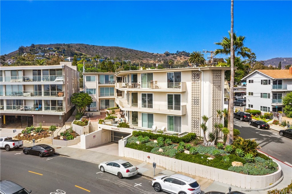 520 Cliff Drive, Unit 303 Laguna Beach, CA 92651 - Photo 40 of 46 a front view of a house with a garden