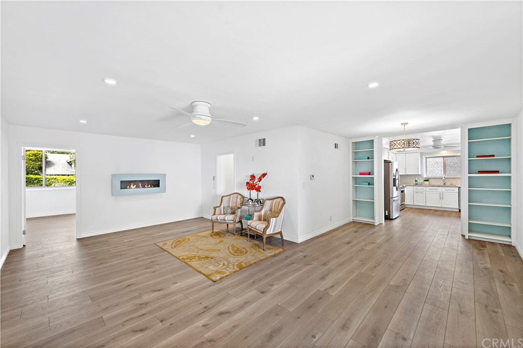 520 Cliff Drive, Unit 303 Laguna Beach, CA 92651 - Photo 6 of 46 a living room with furniture and a wooden floor