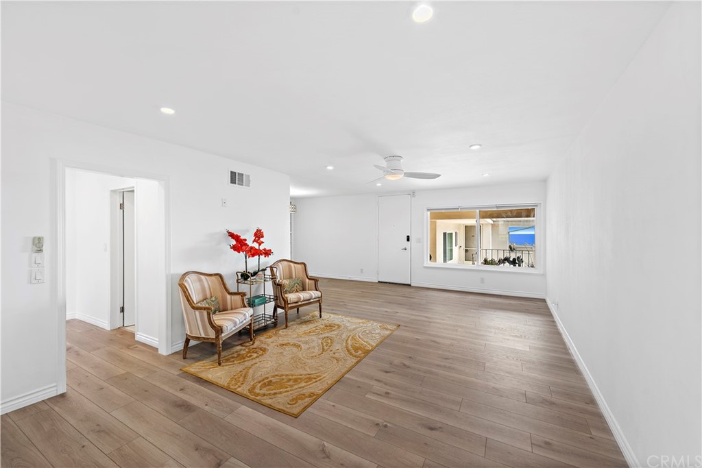 520 Cliff Drive, Unit 303 Laguna Beach, CA 92651 - Photo 7 of 46 a living room with furniture and a wooden floor