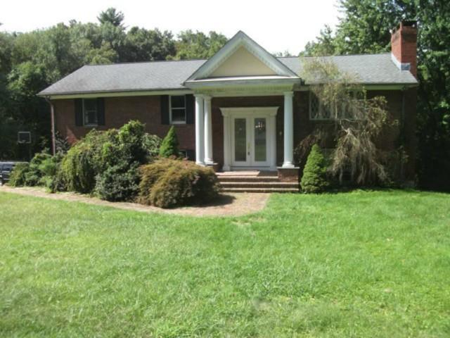 61 Philo Curtis Road Newtown, CT 06482 - Photo 1 of 1 a view of house with a yard