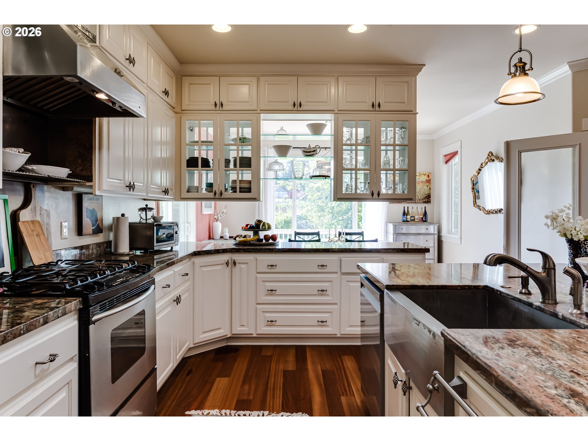 34386 Mathews Road Eugene, OR 97405 - Photo 33 of 48 a kitchen with granite countertop a sink a stove and cabinets