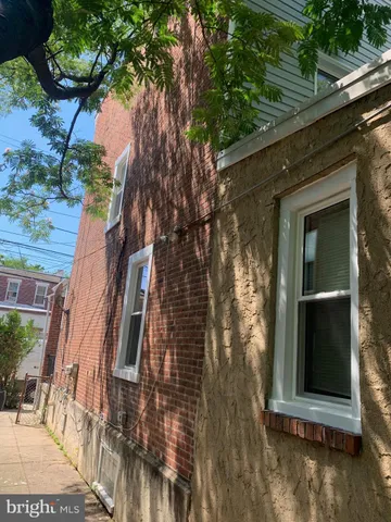 a view of a house with a tree