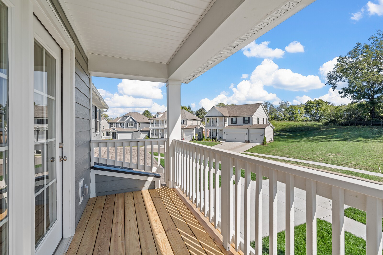 918 Heatherfield Ln Spring Hill Spring Hill, TN 37174 - Photo 24 of 35 a view of a balcony with wooden floor